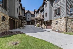 a walkway in front of some apartment buildings at Pinnacle Ridge Luxury Condo 2 in Whitefish