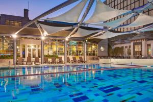 a large swimming pool with a marquee in a building at Crowne Plaza Kuwait Al Thuraya City, an IHG Hotel in Kuwait