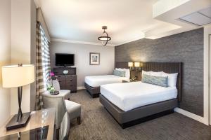 A bed or beds in a room at Handlery Union Square Hotel