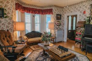 a living room with a couch and a table at The Greenfield Inn in Greenfield