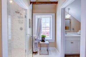 a bathroom with a shower and a sink at The Charleston Chestnut Mansion in Charleston