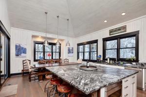 a kitchen with a large marble counter top in a room at Whispering Pines Chalet in Vista