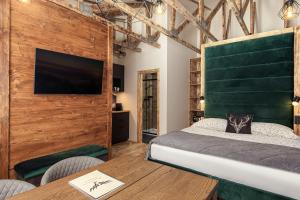 TV a/nebo společenská místnost v ubytování Mumlava Resort Harrachov + 28 fotografií