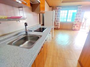 Kuchyň nebo kuchyňský kout v ubytování Oh My Family Pension + 37 fotografií