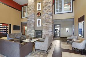 a lobby with couches and a fireplace at Best Western Plus Castle Rock in Castle Rock