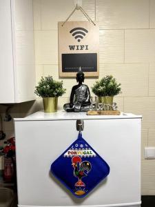 a white counter with a blue napkin on top of it at Artistic Digital Getaway - Patio & GREAT Location! in Lisbon