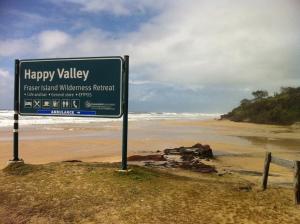 a happy valley sign next to a beach at Fraser Island Retreat in Fraser Island