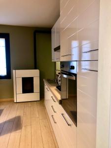 Kuchyň nebo kuchyňský kout v ubytování Pizzighettone Residenza La Corte