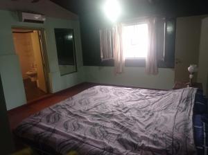 Una cama o camas en una habitación de Casa de campo Villa Rebeca