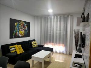 Posedenie v ubytovaní Apartamento Moderno con PISCINA Garaje Wifi AC