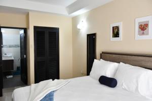 Postel nebo postele na pokoji v ubytování Reggae Inn