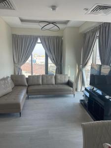 Posezení v ubytování New High End Residence - Al Jaddaf