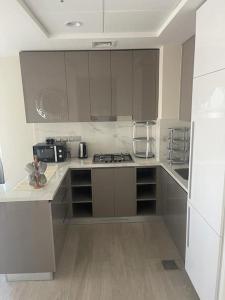 Kuchyň nebo kuchyňský kout v ubytování New High End Residence - Al Jaddaf
