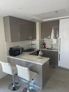 Kuchyň nebo kuchyňský kout v ubytování New High End Residence - Al Jaddaf