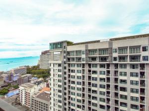 an aerial view of a tall white building at Many Holiday The Base Condo in Pattaya Central