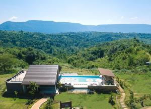 an aerial view of a house with a swimming pool at Sabaidee Valley in Ban Gnik