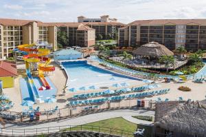 an aerial view of a pool at a resort at STUNNING CONDO NEAR UNIVERSAL STUDIOS in Orlando