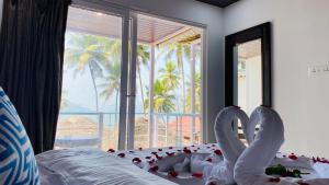 Ένα ή περισσότερα κρεβάτια σε δωμάτιο στο Grand Sea Shades Goa