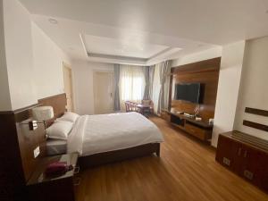 Letto o letti in una camera di YULOKO GUEST HOUSE