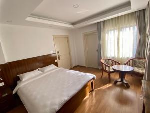 Letto o letti in una camera di YULOKO GUEST HOUSE
