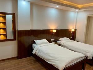 Letto o letti in una camera di YULOKO GUEST HOUSE