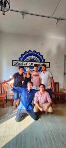 a group of people posing for a picture on a bed at Hostel Mandala in Anjuna