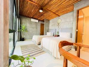 Ένα ή περισσότερα κρεβάτια σε δωμάτιο στο Luz de Luna Tulum Villa +31 φωτογραφίες