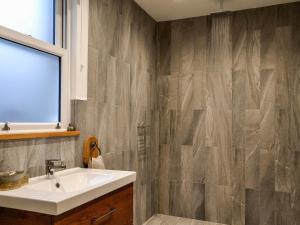 a bathroom with a sink and a shower at Cotlea East Cottage in Alyth