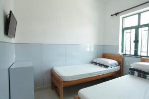Katil atau katil-katil dalam bilik di Ah Shan Hostel