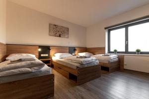 Posteľ alebo postele v izbe v ubytovaní Apartmány Lucie