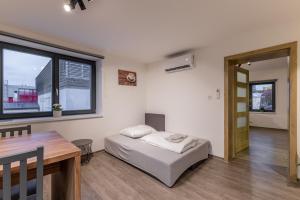 Posteľ alebo postele v izbe v ubytovaní Apartmány Lucie