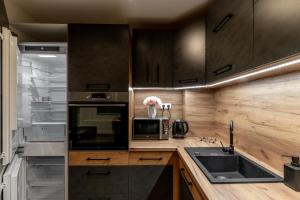 Kuchyňa alebo kuchynka v ubytovaní Apartmány Lucie