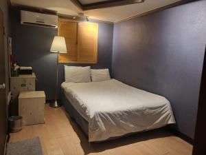 Ένα ή περισσότερα κρεβάτια σε δωμάτιο στο G Mini Hotel Dongdaemun