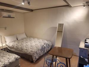 Ένα ή περισσότερα κρεβάτια σε δωμάτιο στο G Mini Hotel Dongdaemun