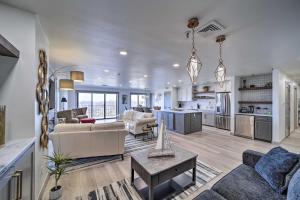 a large living room with a couch and a table at Balcony & Lake View: Modern Condo in Monkey Island in Monkey Island