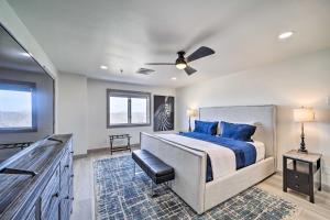 a bedroom with a bed and a ceiling fan at Balcony & Lake View: Modern Condo in Monkey Island in Monkey Island