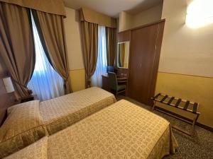 Ένα ή περισσότερα κρεβάτια σε δωμάτιο στο Hotel Kristall