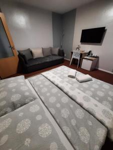 Postel nebo postele na pokoji v ubytování Hotel Boršičanka
