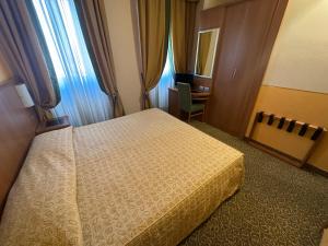 Ένα ή περισσότερα κρεβάτια σε δωμάτιο στο Hotel Kristall