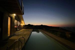a pool of water with the sunset in the background at Little Cuttlefish on Kangaroo Island in Penneshaw