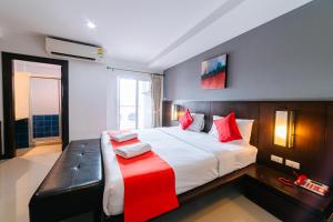 Postel nebo postele na pokoji v ubytování Ratana Hotel Sakdidet, PHUKET TOWN