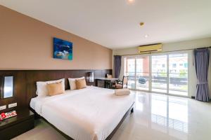 Postel nebo postele na pokoji v ubytování Ratana Hotel Sakdidet, PHUKET TOWN