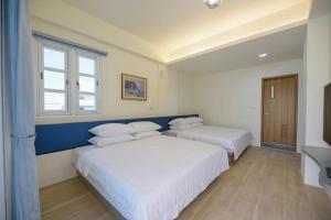 Postel nebo postele na pokoji v ubytování Island Arch Homestay