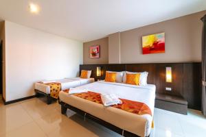 Postel nebo postele na pokoji v ubytování Ratana Hotel Sakdidet, PHUKET TOWN