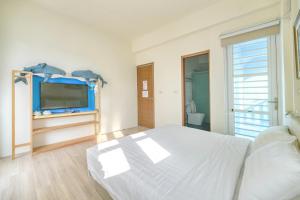 TV a/nebo společenská místnost v ubytování Island Arch Homestay