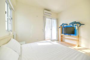 Postel nebo postele na pokoji v ubytování Island Arch Homestay