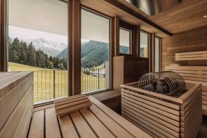 a sauna with a view of a mountain at Alpine Resort Sportalm in Sankt Leonhard im Pitztal