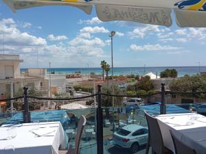 a view of the ocean from the balcony of a resort at Casa Marugii in Maruggio