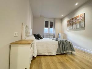 A bed or beds in a room at Mk77 - Gran Via