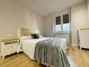 A bed or beds in a room at Mk77 - Gran Via